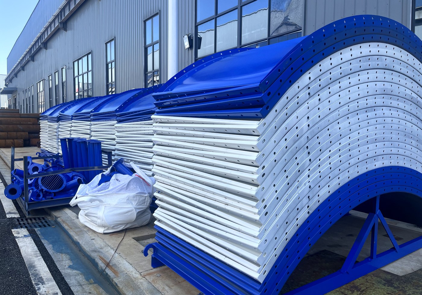 Coated bolted silo panels stacked for modular assembly